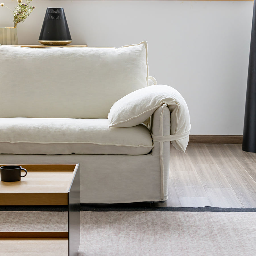 Cream cotton fabric 1 seater sofa folding ear primary product view.