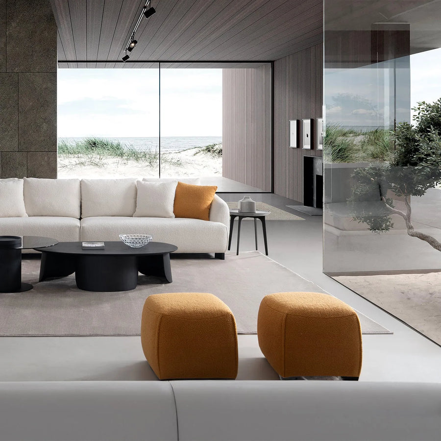 Cream sherpa fabric ottoman saffron primary product view.