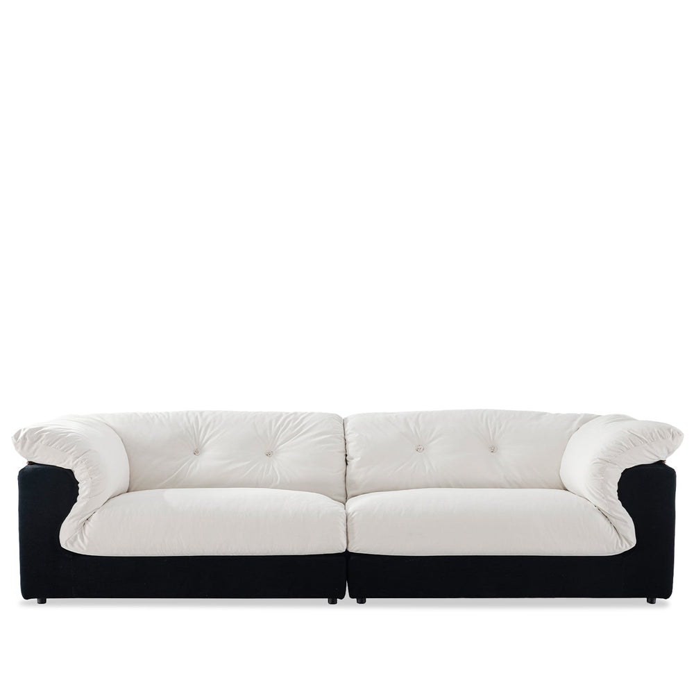 Cream suede fabric 4 seater sofa camellia in white background.