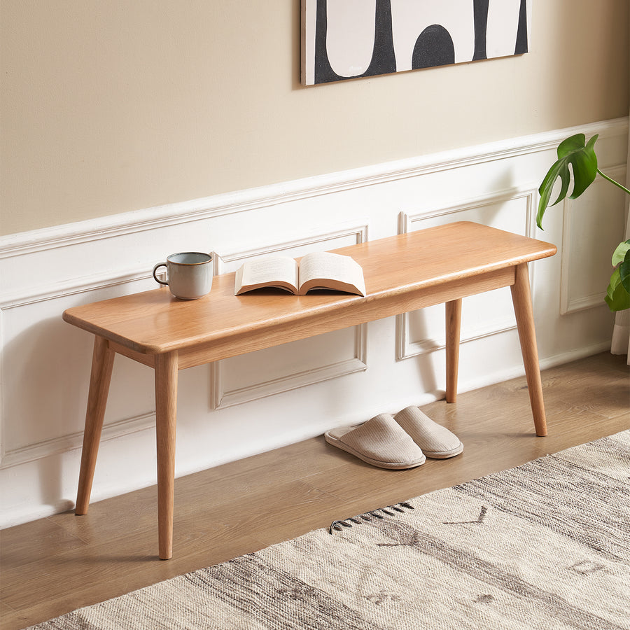 Scandinavian oak wood dining bench with cushion sereno primary product view.